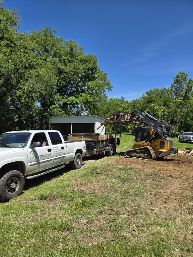 Cutting Edge Lawn and Landscapes leveling the ground after demolition in Spring Hill, TN, preparing for future landscaping.