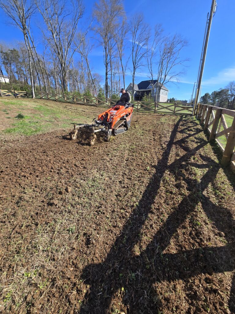 sod installation Columbia TN yard preparation with skid steer and soil grading