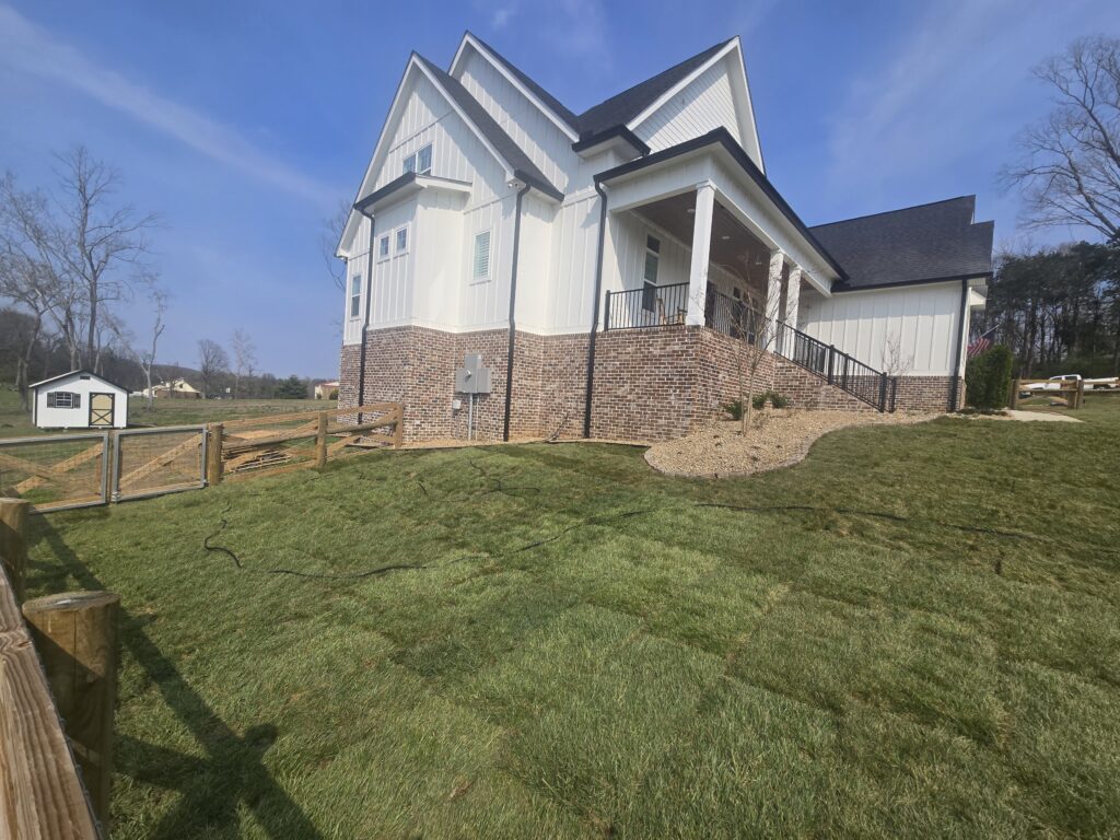 completed sod installation in Columbia TN backyard with healthy green lawn